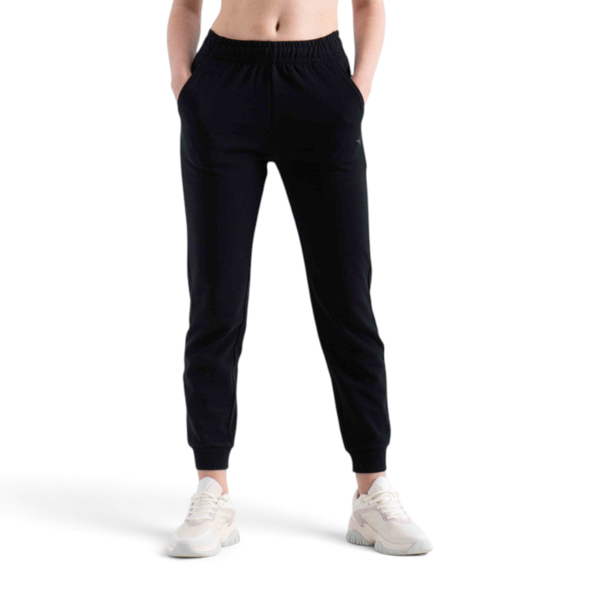FRG knit track pants in black with an elasticated waistband and cuffed ankles worn with white sneakers