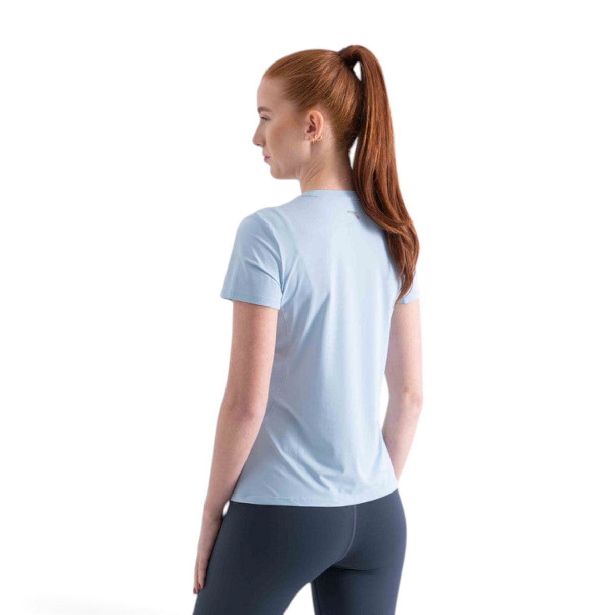 FRG light blue short sleeve athletic t-shirt worn by a woman with a ponytail, back view