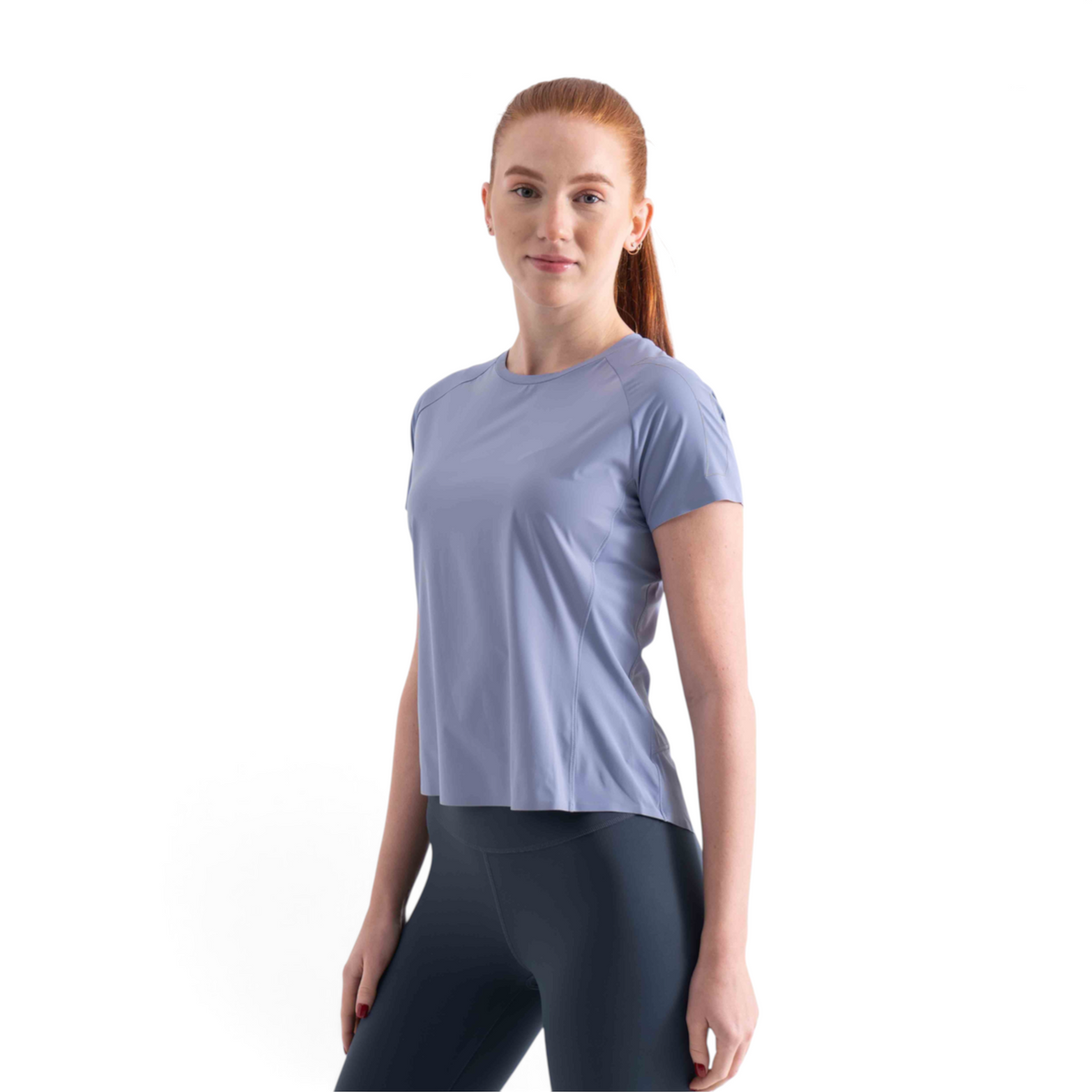 FRG short sleeve athletic t-shirt in periwinkle blue worn by a woman with red hair against a white background