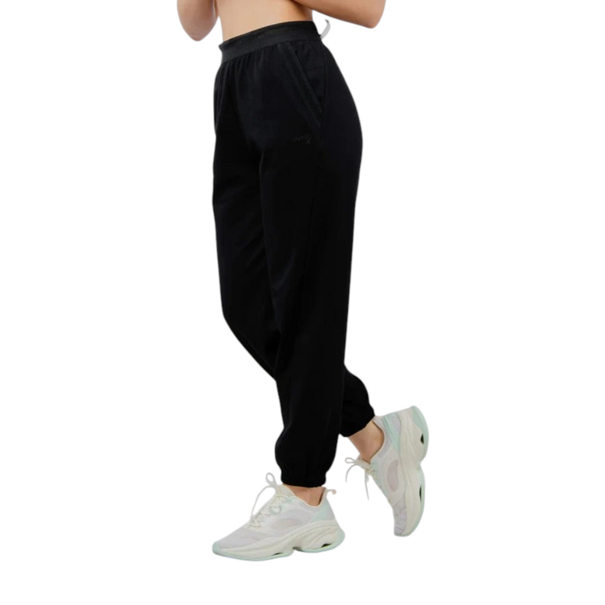 FRG ANTA knit track pants in basic black with a comfortable elastic waistband and cuffed ankles on a model
