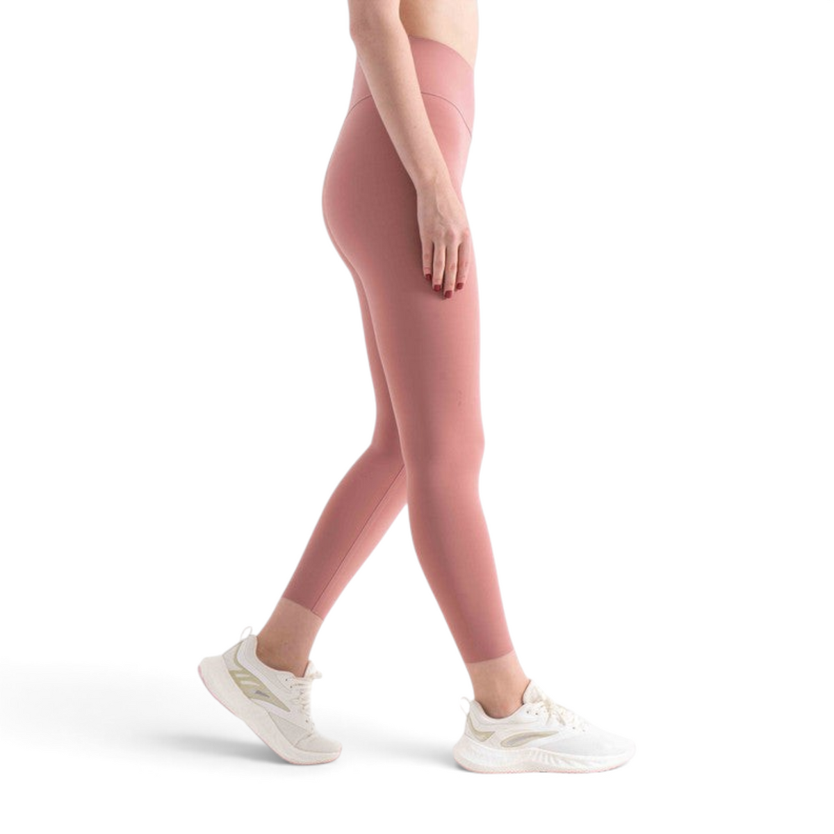FRG slim fit ankle pants in dusty rose nylon spandex worn by a model with white athletic sneakers