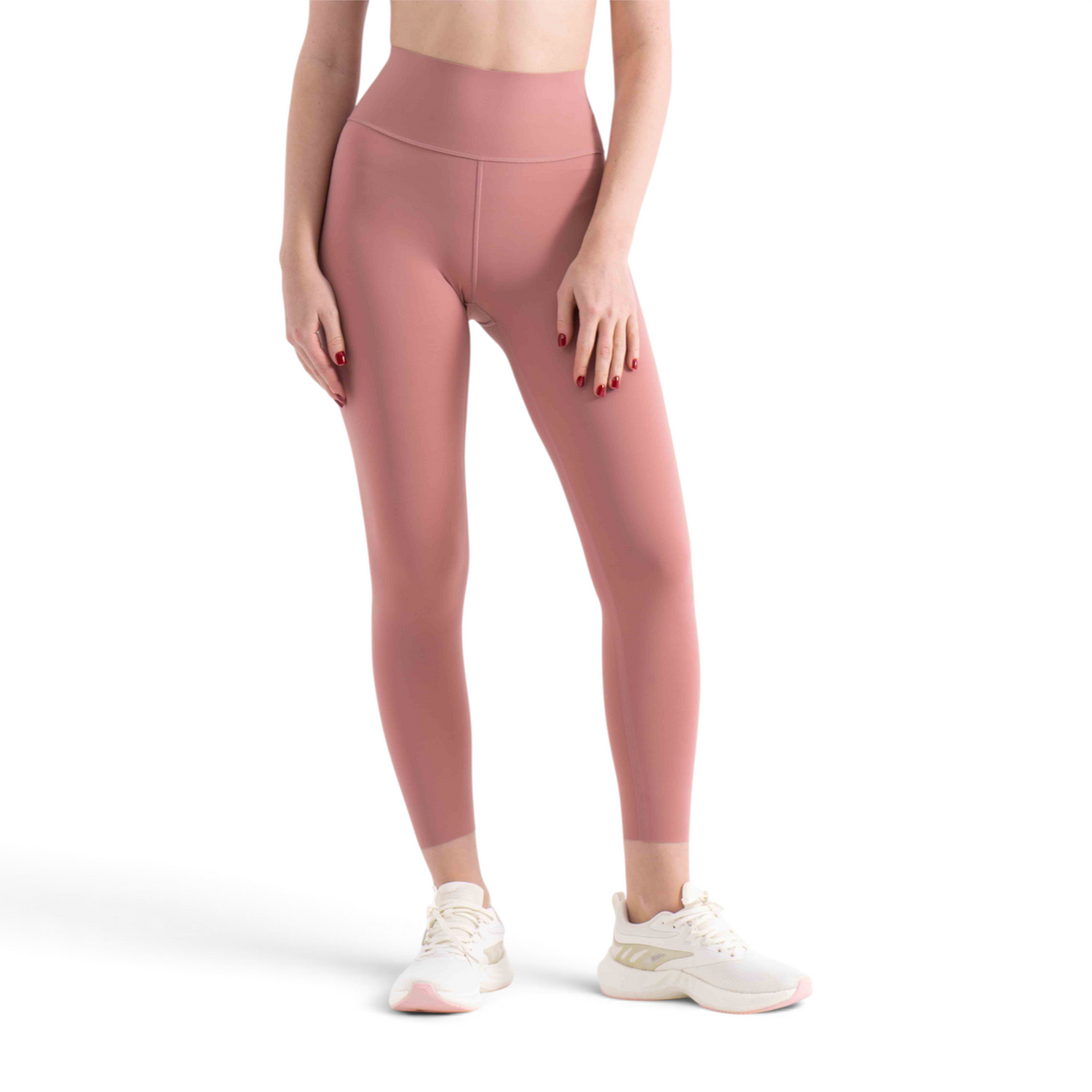 FRG slim fit ankle pants in dusty rose nylon spandex blend worn by a model with white athletic sneakers