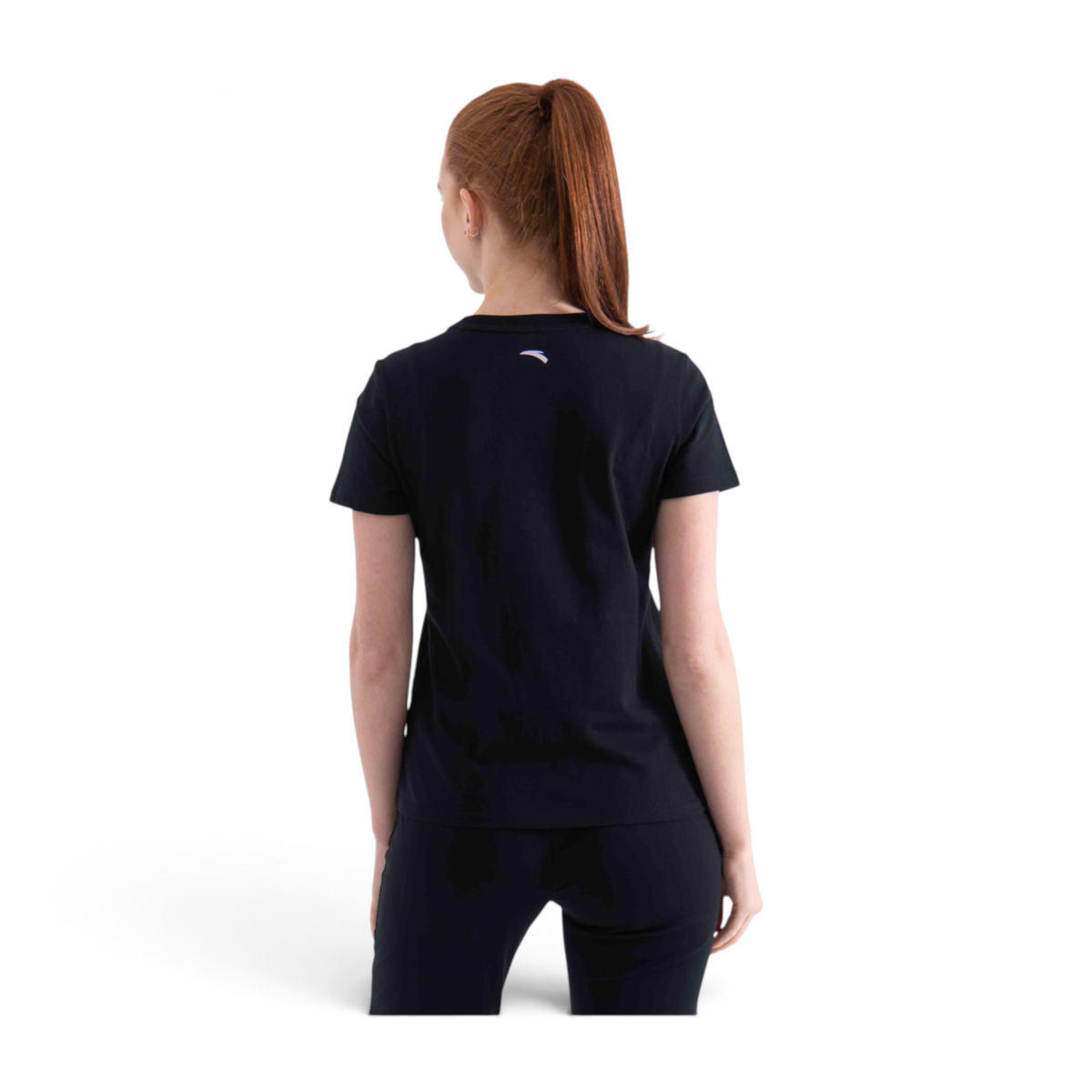 FRG black short sleeve t-shirt viewed from the back on a woman with a ponytail, featuring a small logo at the neck.