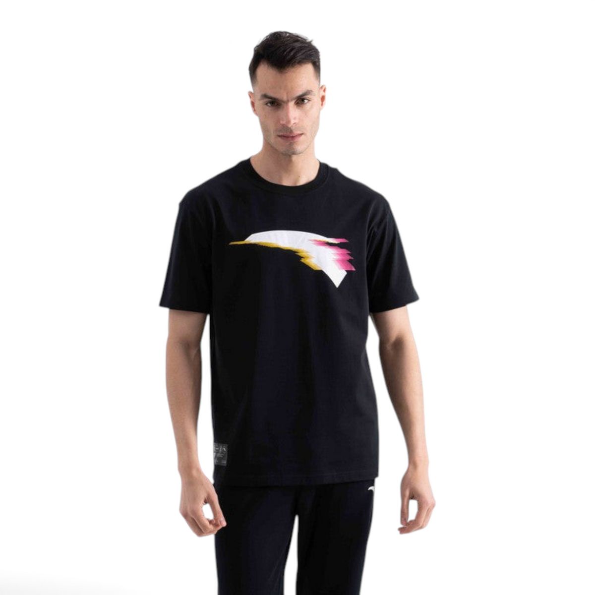 FRG black short sleeve t-shirt with a white, yellow, and pink abstract graphic print on the chest