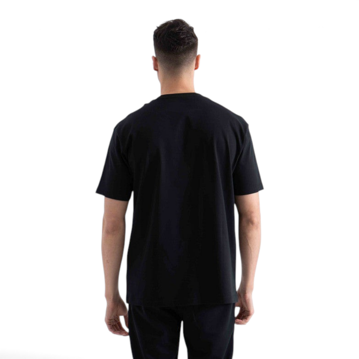 Back view of a man wearing a plain black short-sleeve crew neck t-shirt from FRG