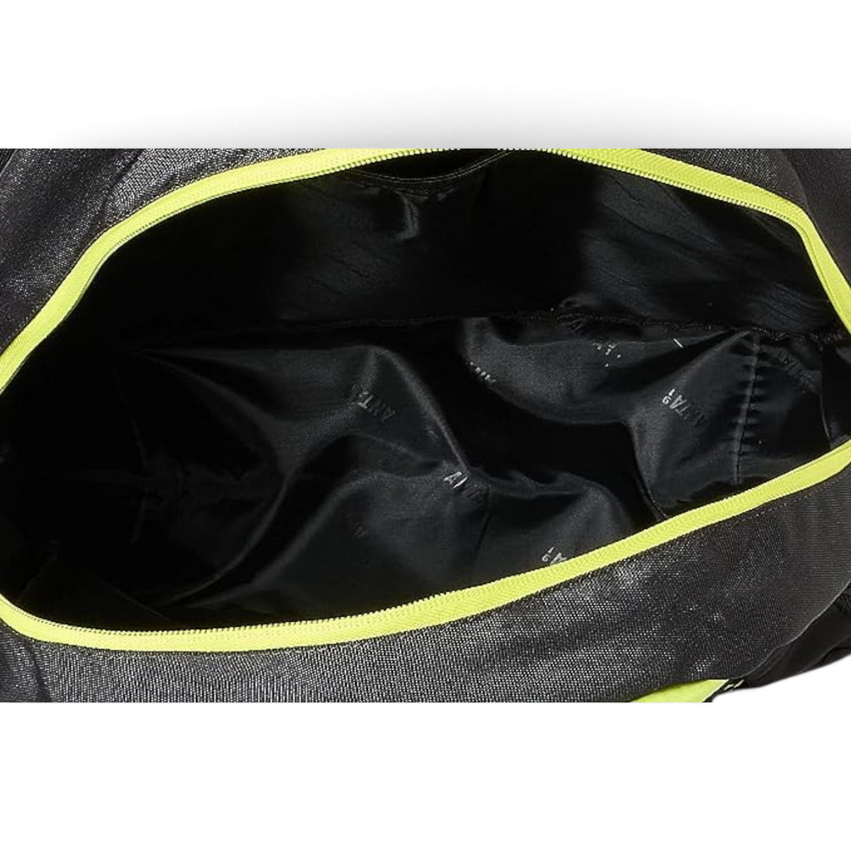 Interior view of a black FRG backpack with a bright lime green zipper lining and branded fabric lining