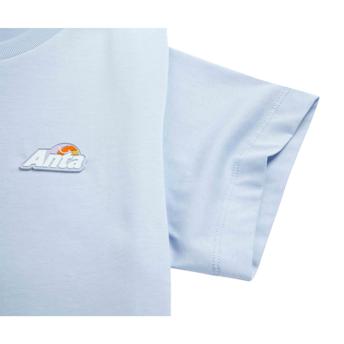 FRG light blue short sleeve t-shirt featuring a raised Anta logo patch with a sunset graphic
