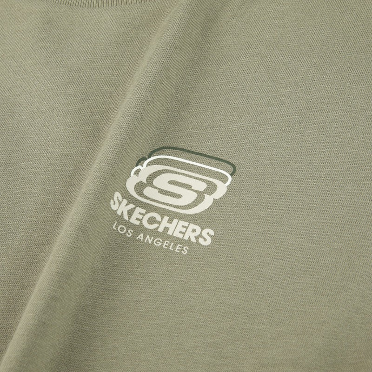 FRG olive green lifestyle top featuring a white and dark green Skechers Los Angeles logo graphic on the chest