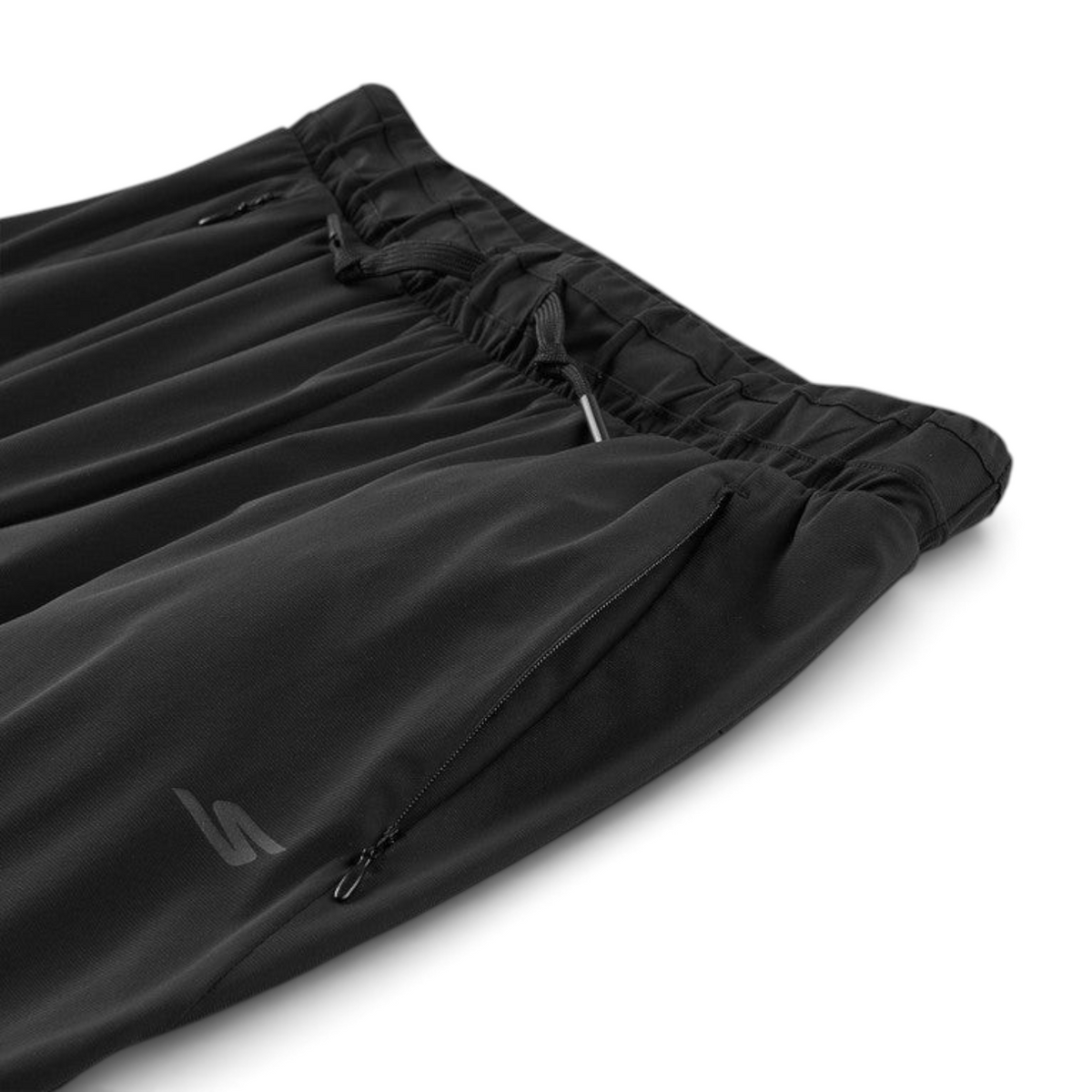FRG black woven athletic pants featuring an elastic drawstring waistband and zippered side pockets