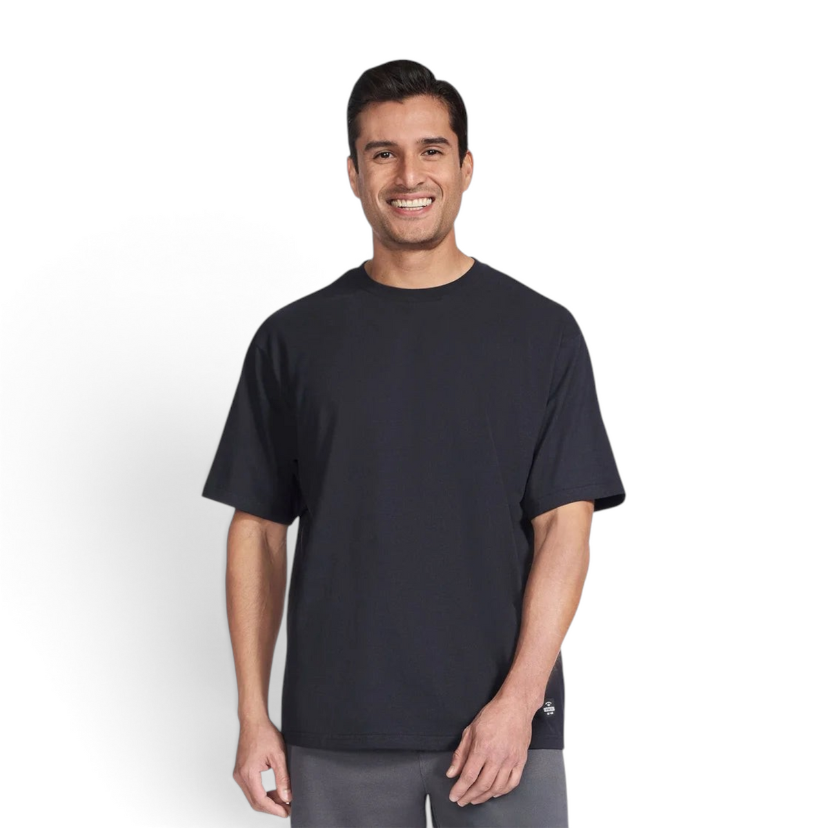 A man wearing a black Skechers JERSEY MAX short sleeve crew neck t-shirt from FRG against a plain white background.