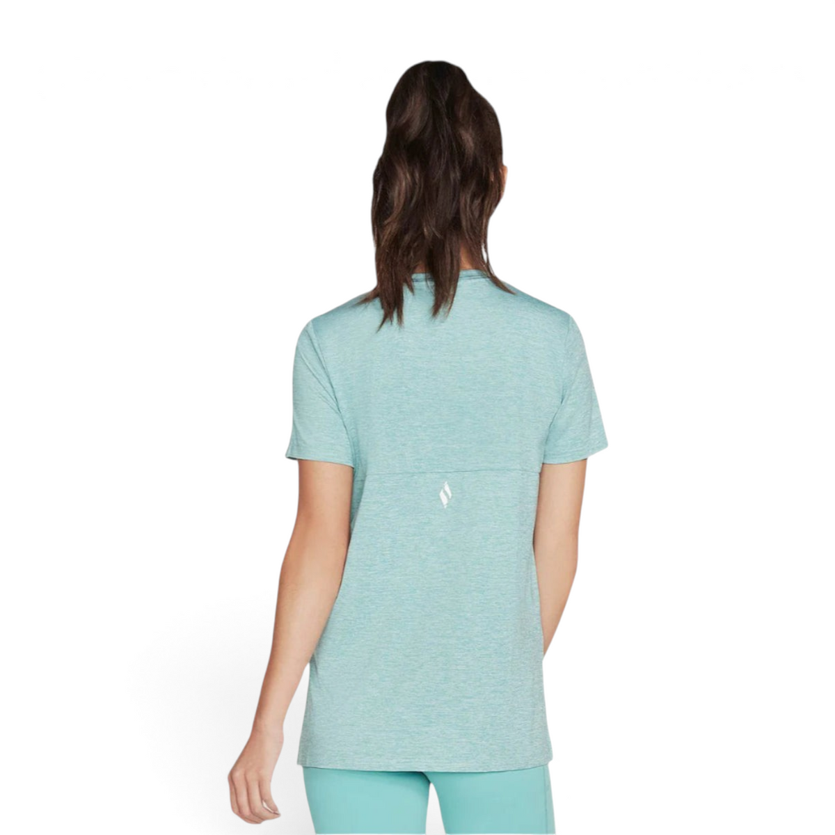 Back view of a woman wearing a FRG teal knit graphic tee with a small reflective logo detail.