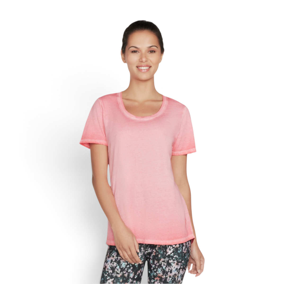 FRG women's pink knit tunic tee with a scoop neckline and short sleeves worn by a smiling model