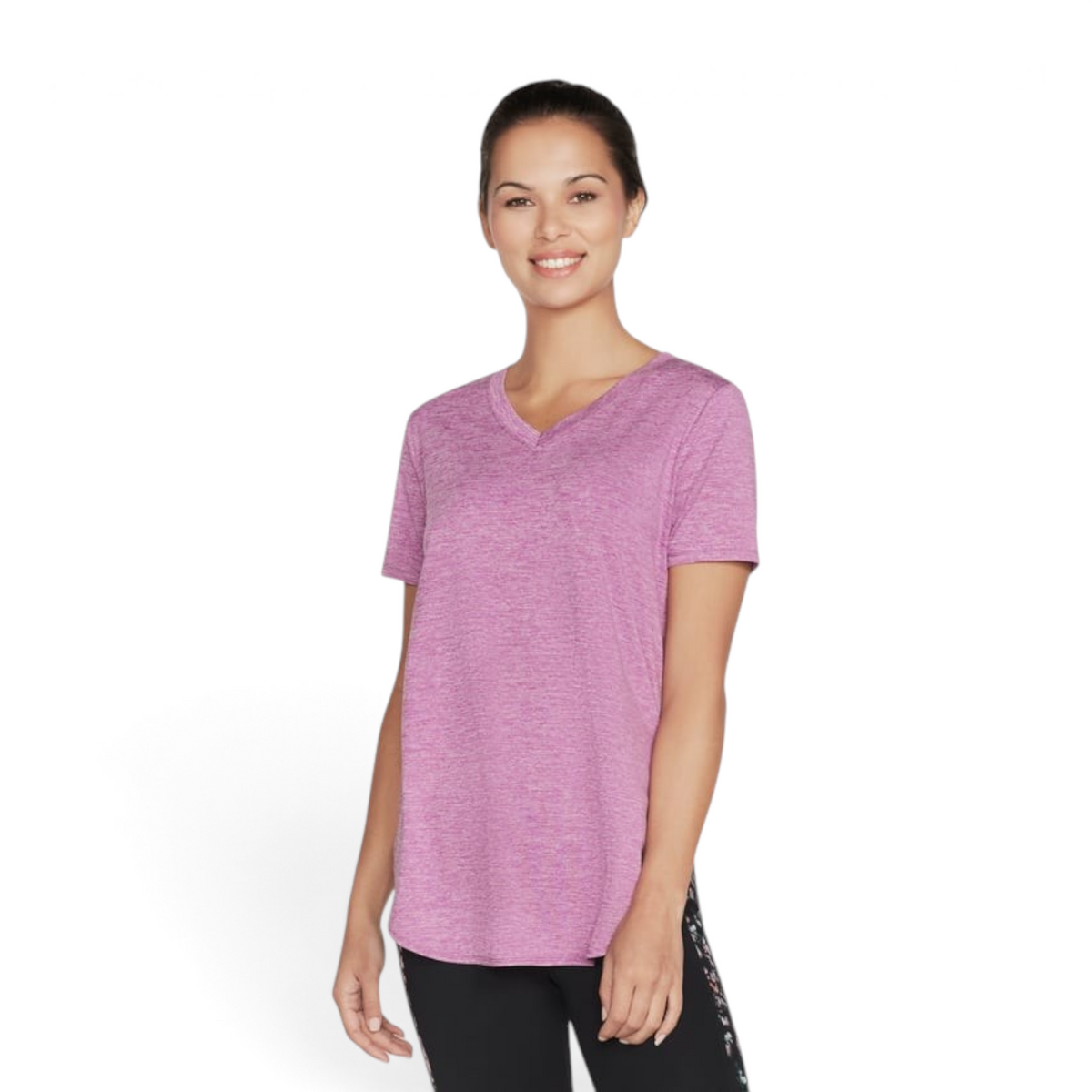 FRG Skechers women's purple and hot pink short sleeve knit tunic with a v-neckline worn by a smiling model
