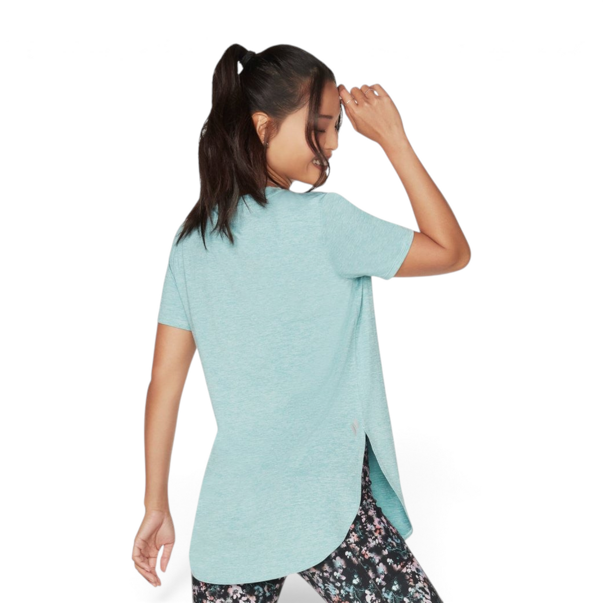 FRG Skechers GO Walk Wear porcelain blue short-sleeve knit tunic with a high-low hem worn by a model from behind