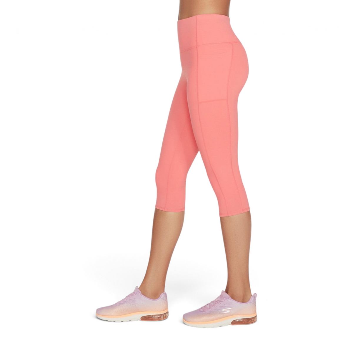 FRG women's coral knit capri leggings with a high waistband and side pockets, worn with athletic sneakers.
