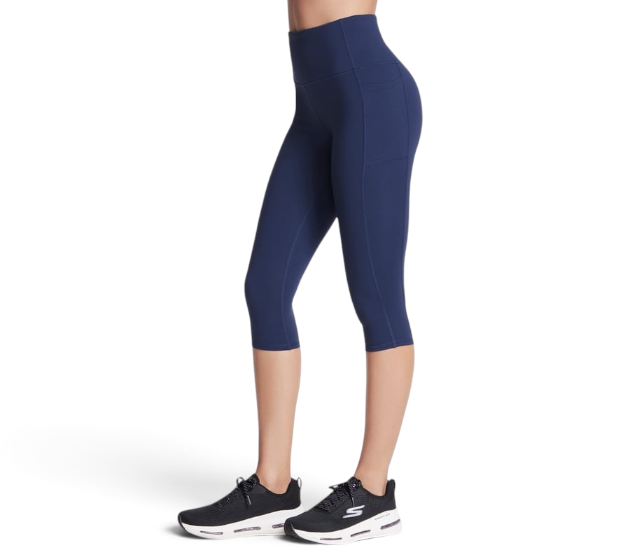 FRG Skechers women's navy high-rise knit capri leggings with side pockets worn with black athletic sneakers