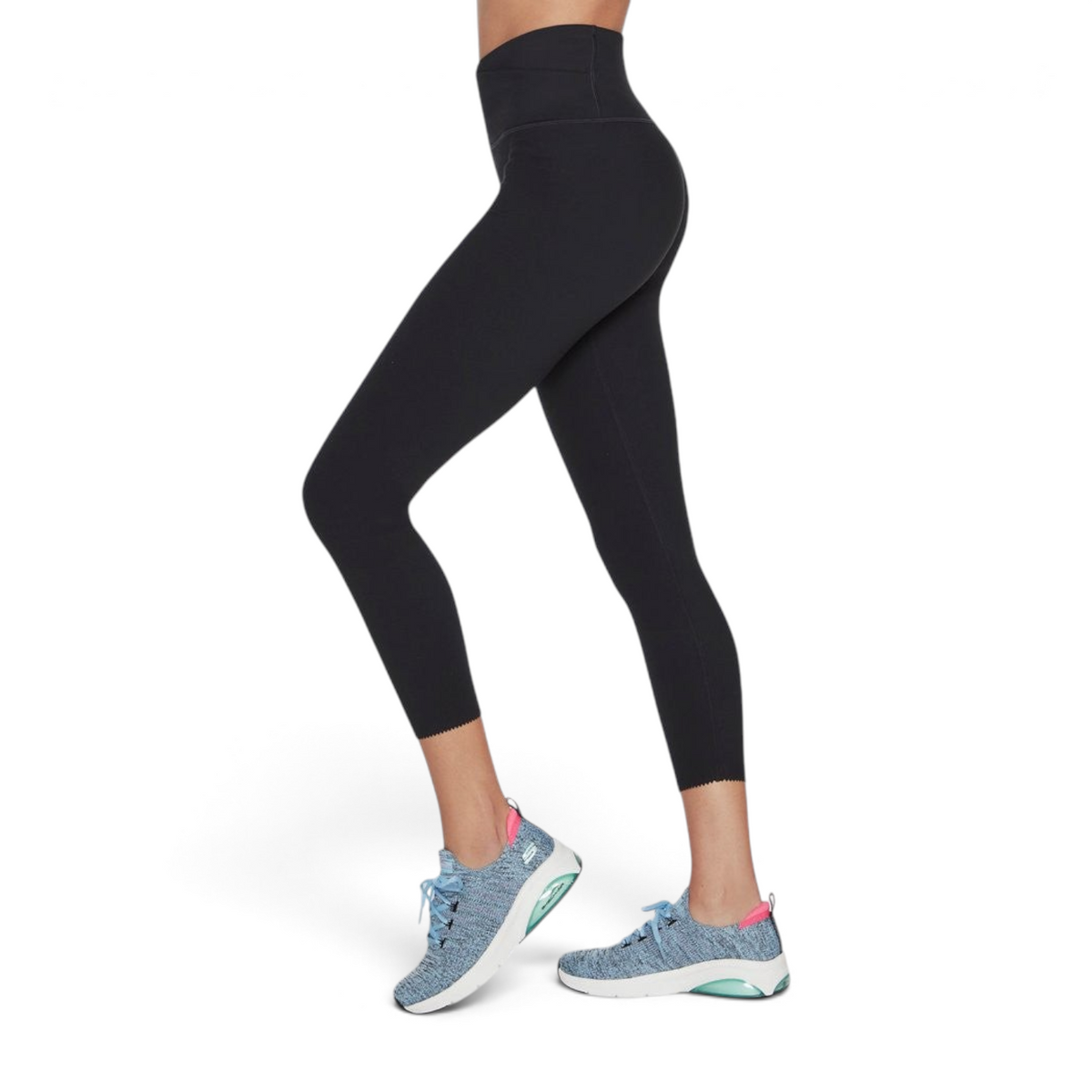 FRG Skechers GO Sculpt black high-waisted 7/8 leggings with a scalloped hem, worn by a model in athletic sneakers.
