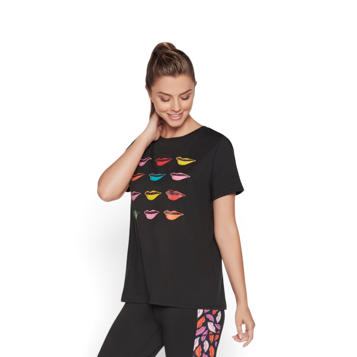 FRG DVF Godri tee in black polyester spandex featuring a colorful lip print pattern on a model