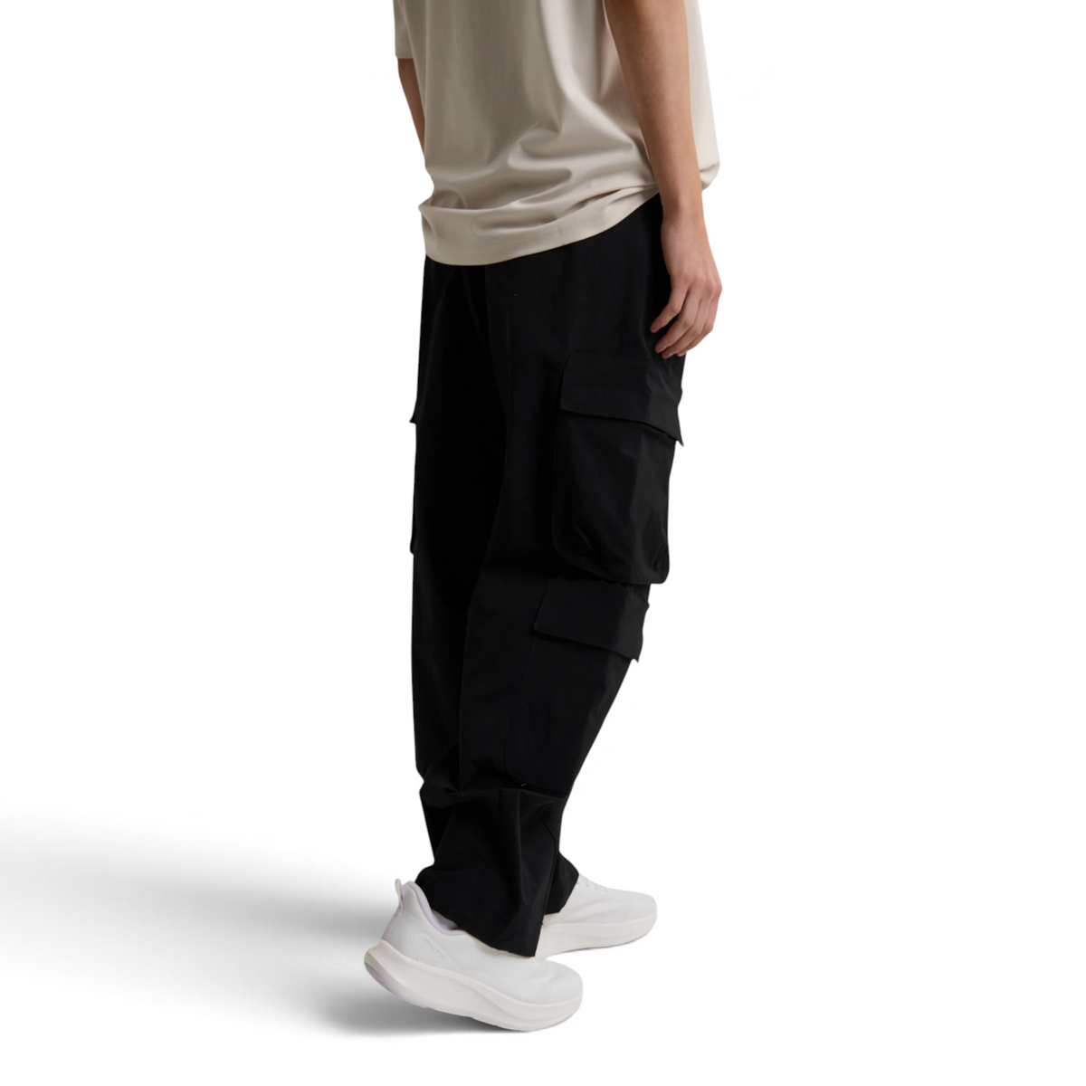 FRG ANTA black woven casual cargo pants with side pockets worn by a model with white sneakers